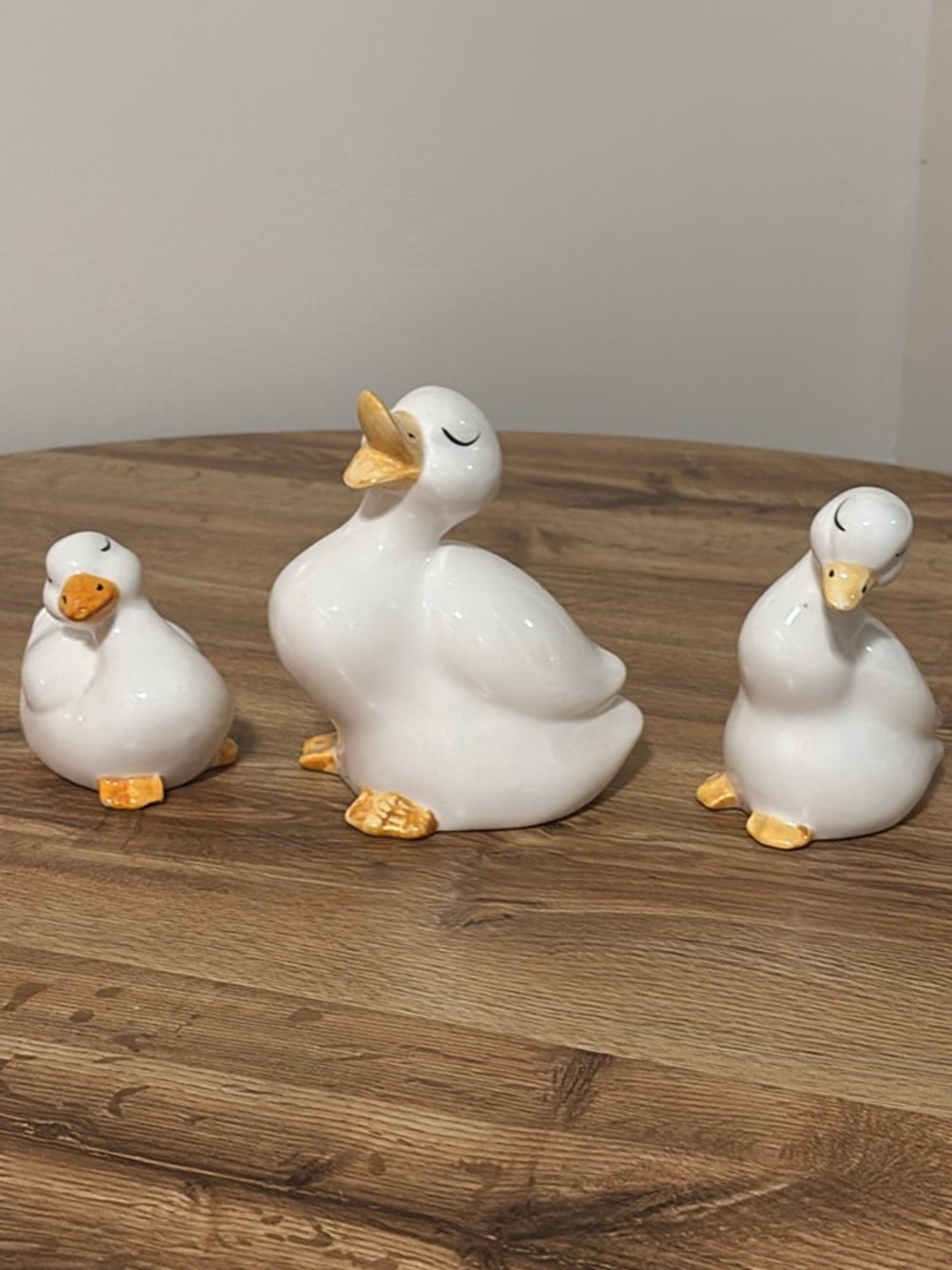 Glossy White Ceramic Duck Trio with Gold Accents